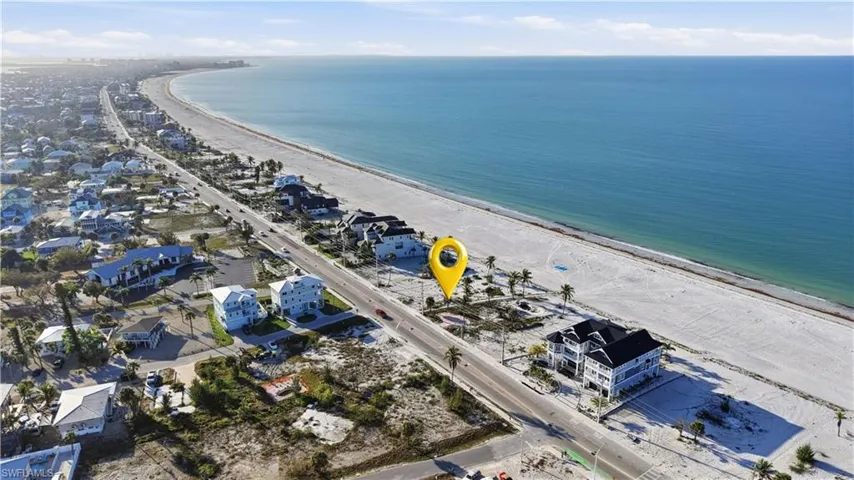 Aerial perspective of suburban area featuring expansive beach - Virtually Edited Image