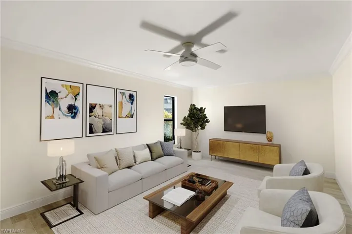 Living room featuring light wood-style flooring, crown molding, and a ceiling fan