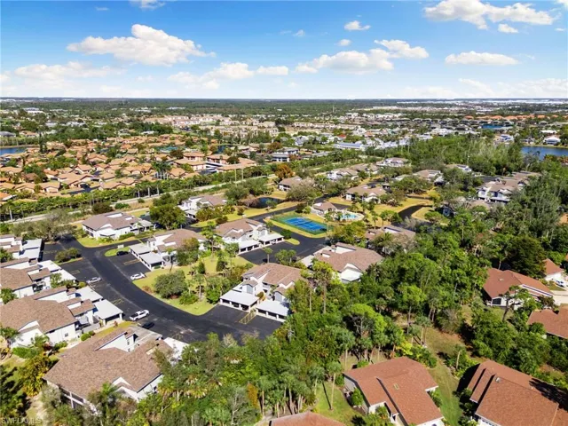 Aerial perspective of suburban area with a large body of water