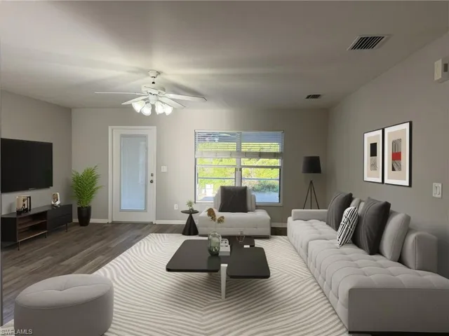 Living room with wood finished floors and ceiling fan