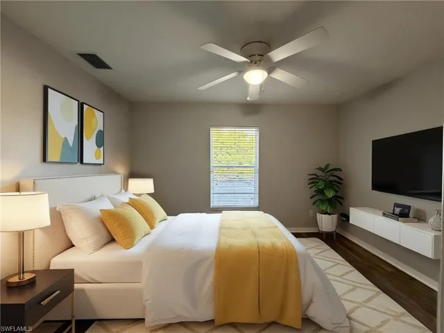 Bedroom featuring dark wood-style flooring and ceiling fan