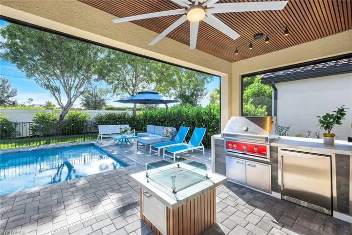 View of patio featuring an outdoor kitchen and a ceiling fan