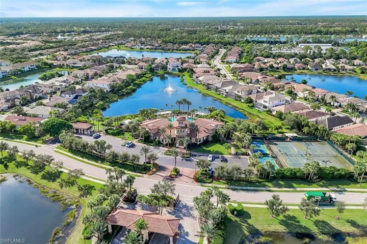 Aerial view of property's location featuring a large body of water and nearby suburban area
