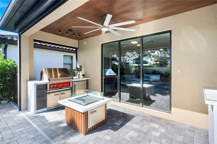 View of patio / terrace featuring area for grilling and a ceiling fan