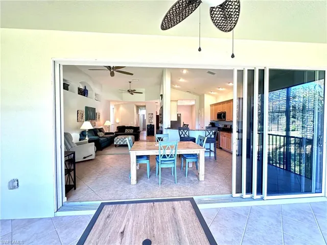 Screened in Balcony with sliders that open up to the Kitchen and Family Room