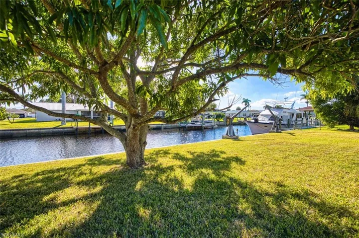 Water view with a boat dock and boat lift