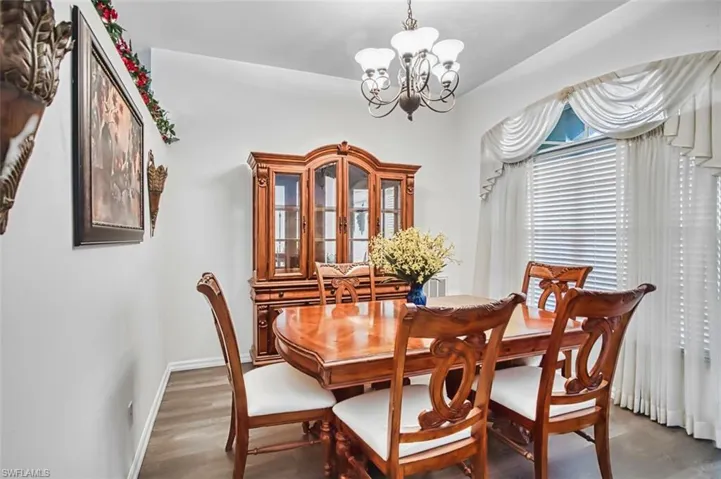 Dining room with a chandelier and wood finished floors