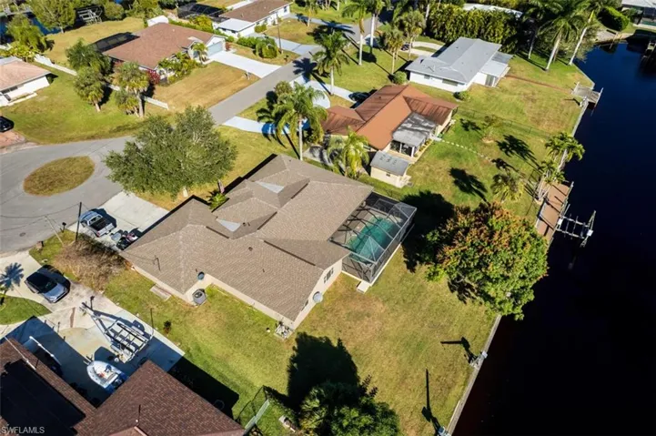 View of property location featuring nearby suburban area and a nearby body of water