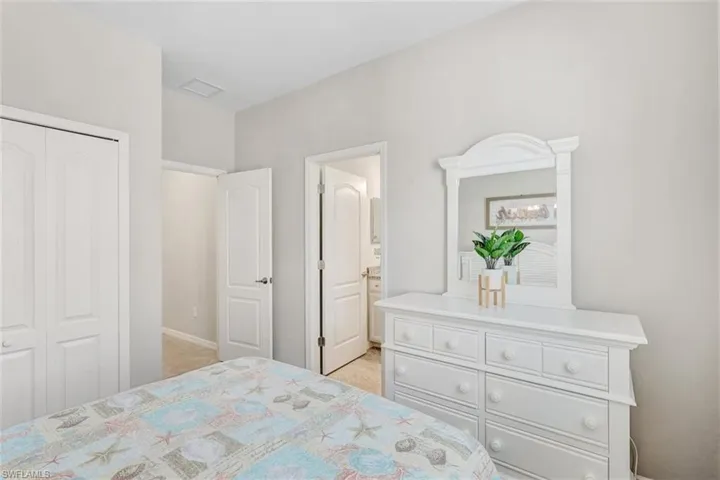 Bedroom featuring a closet and connected bathroom