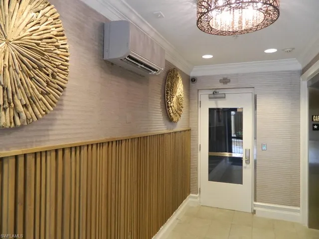 Full bath with vanity, a garden tub, and light tile patterned floors