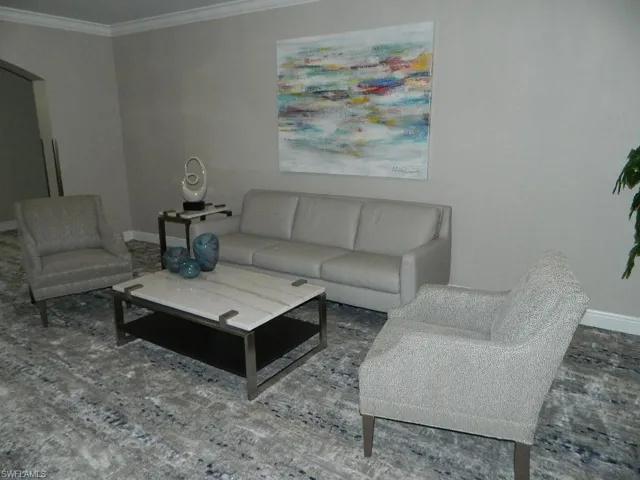 Carpeted spare room with baseboards and a ceiling fan