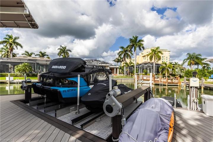 New dock that accommodates 32’ boat with motorized jetski platform and external floating jetski or kayak platform.