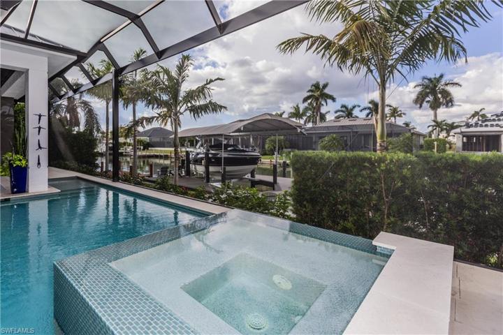 Salt water heated pool and hot tub with Aqualink control and multi color led lights!