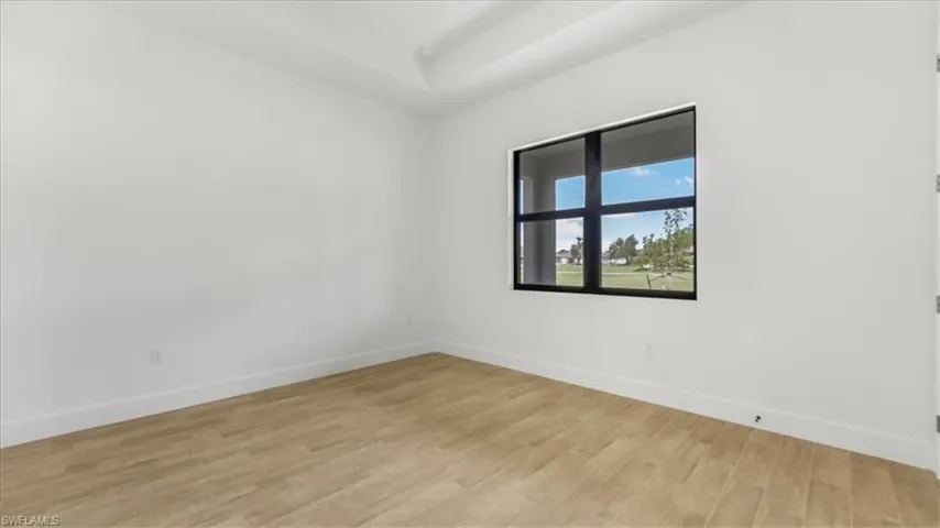 Empty room featuring light wood-style floors and baseboards