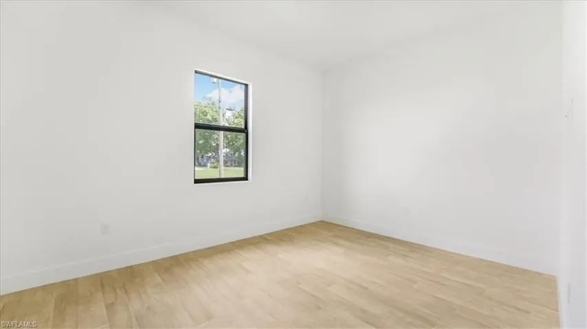 Empty room featuring light wood-type flooring