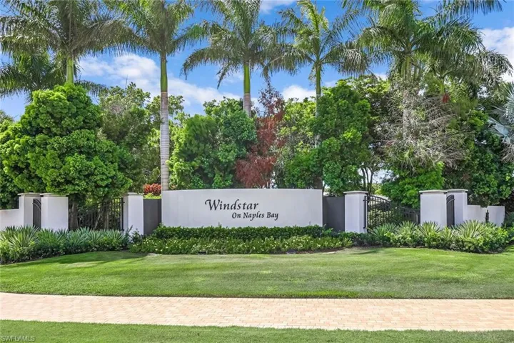 Community sign featuring a lawn