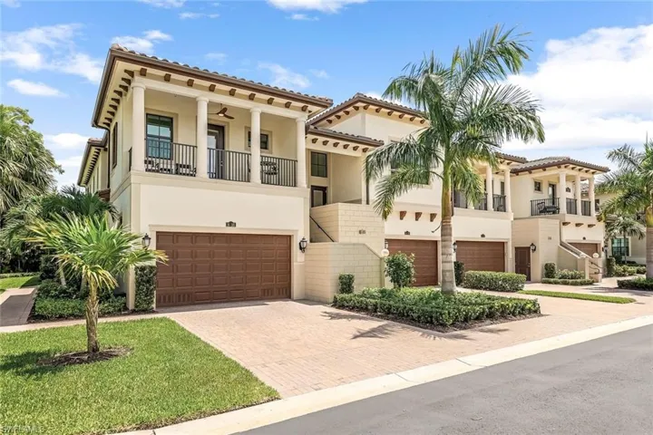 Mediterranean / spanish-style house with a garage and a balcony