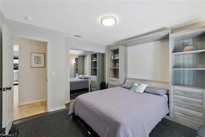 Bedroom featuring a closet and baseboards