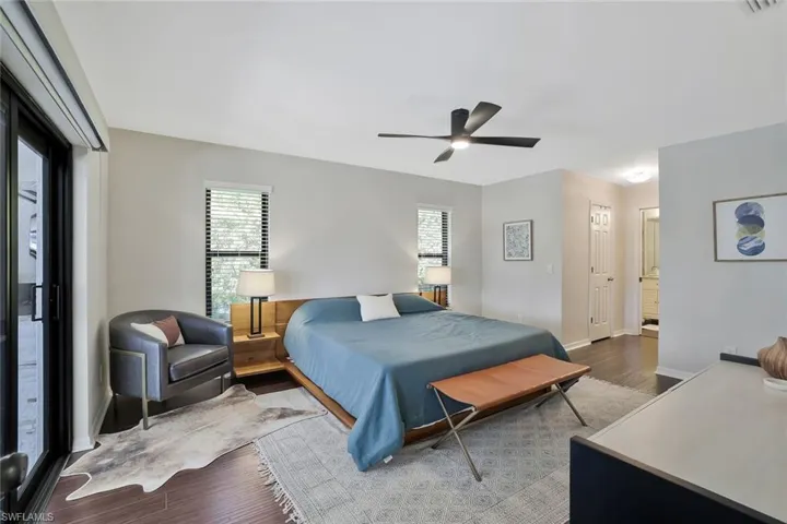 Bedroom with wood finished floors and a ceiling fan