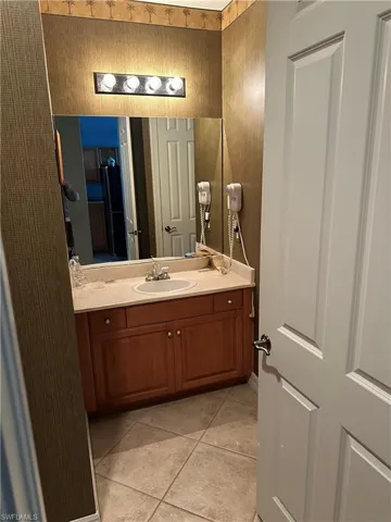 Bathroom featuring vanity and light tile patterned floors