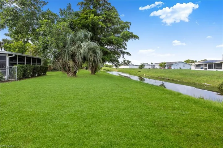 View of grassy yard featuring a residential view