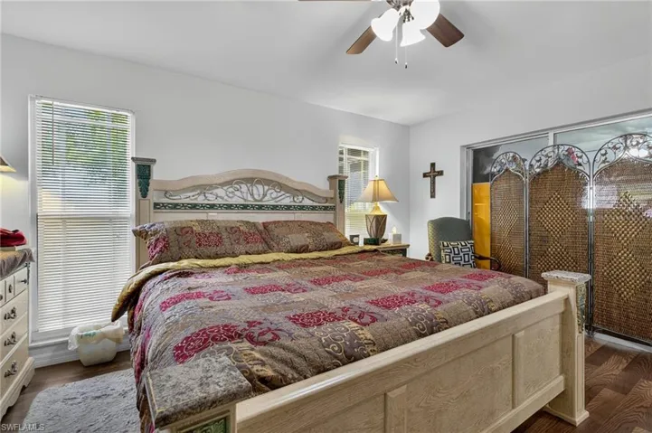 Bedroom featuring wood finished floors and a ceiling fan