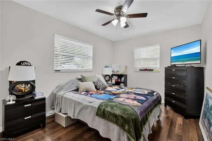 Bedroom featuring wood finished floors and ceiling fan
