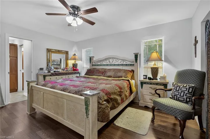 Bedroom with wood finished floors and ceiling fan