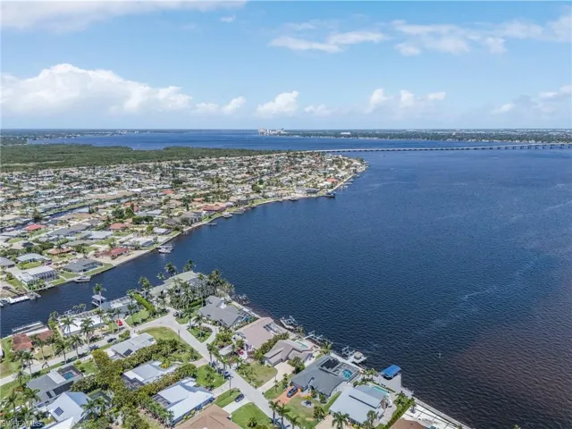 Bird's eye view with a water view and a residential view You will enjoy the privacy of this oversized lot with lots of room to roam