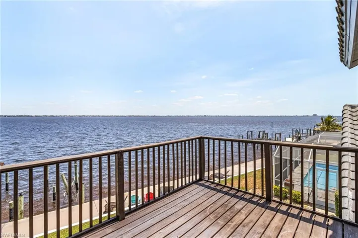 Wooden terrace with a River view and used year round due to South Eastern exposure