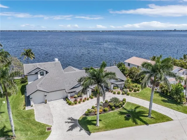 Drone / aerial view with a Caloosahatchie River to the East looking across to Ft. Myers with lots of elbow room here....no reach out and touch your neighbor on half acre lot