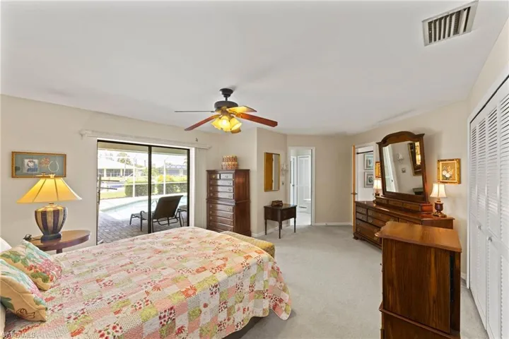 The Primary bedroom has set of sliders and has a private bathroom with exit door to lanai.