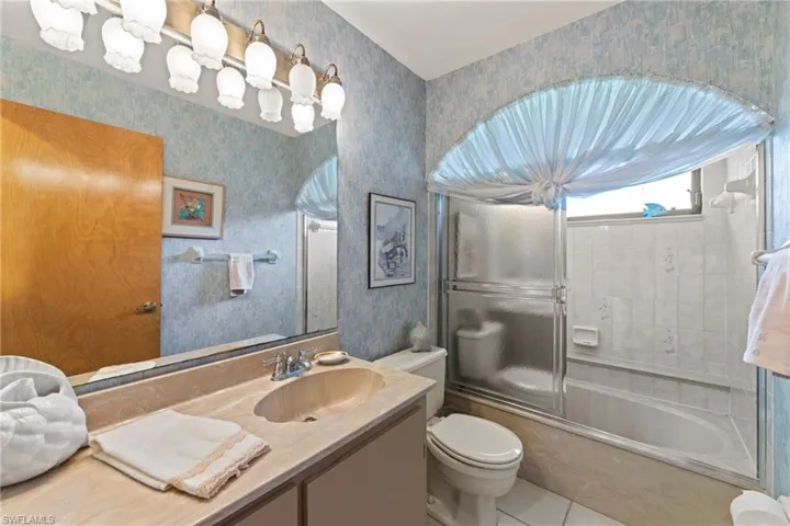 guest bath has combo shower & tub