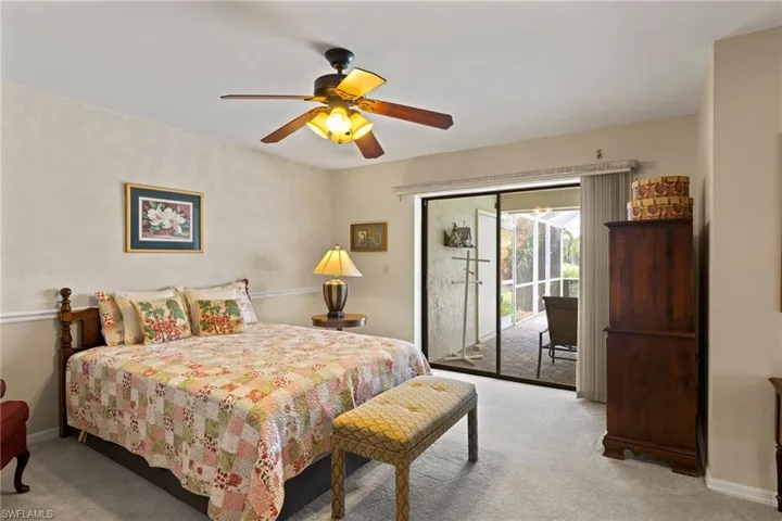 Master bedroom has sliders out to the lanai & pool