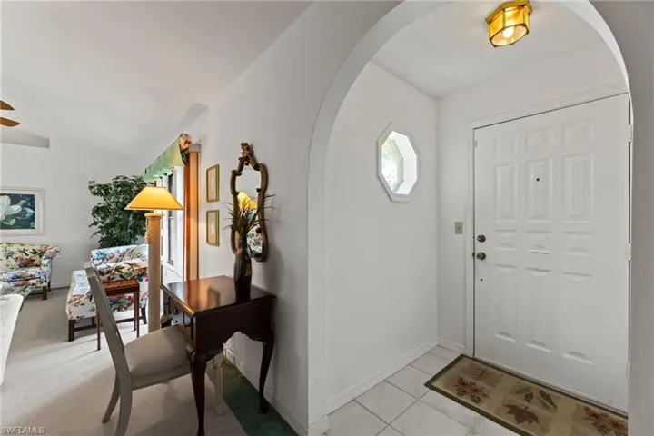 Foyer area is welcoming with the nautical window.