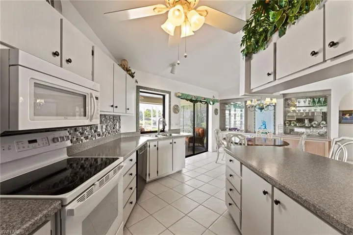 All appliances included, plus additional refrigerator/freezer in the garage.