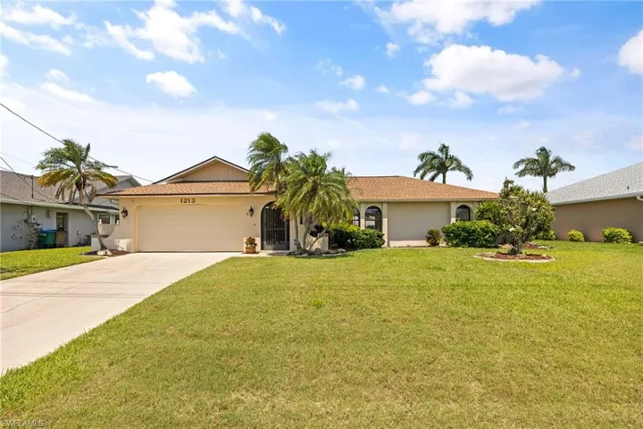 This home has a pretty front yard.