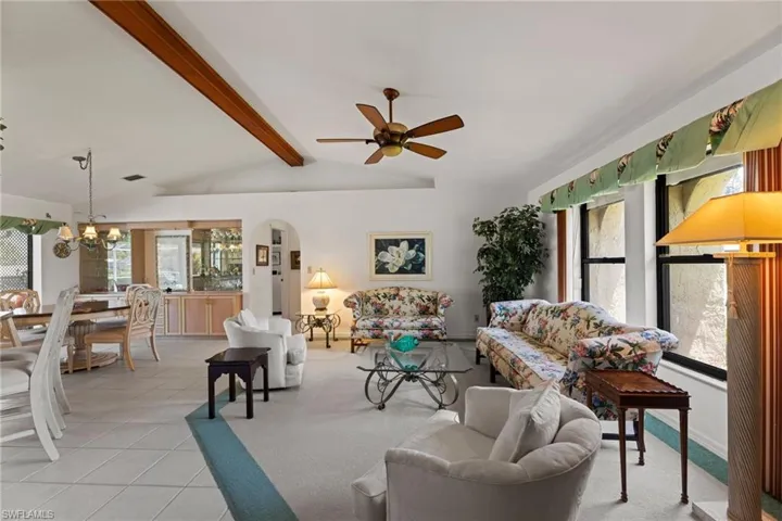 The Vaulted ceiling with wood beam adds character.