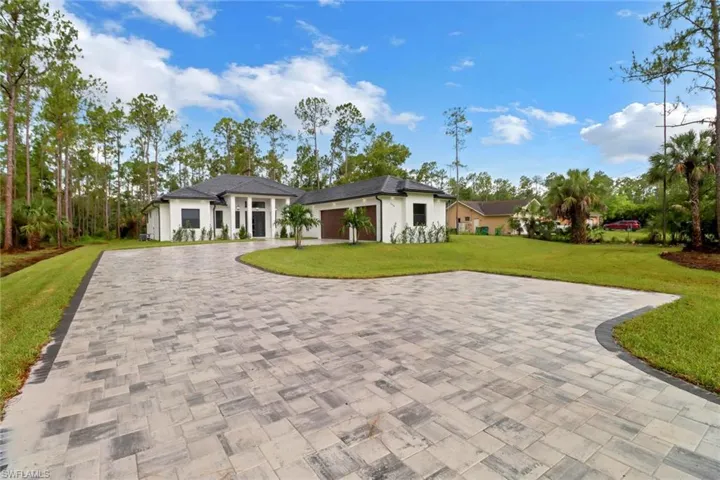 View of front of property with a front yard