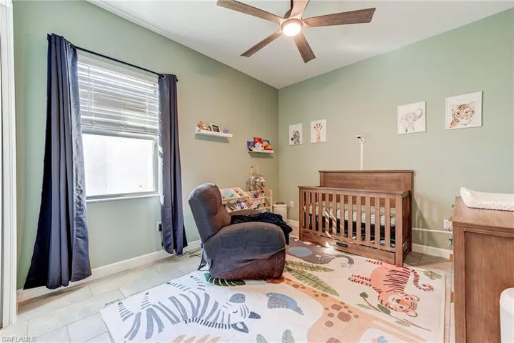 Guest Bedroom featuring tile patterned floors
