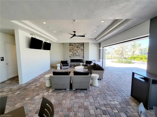 View of patio / terrace  and an outdoor living space with a fireplace