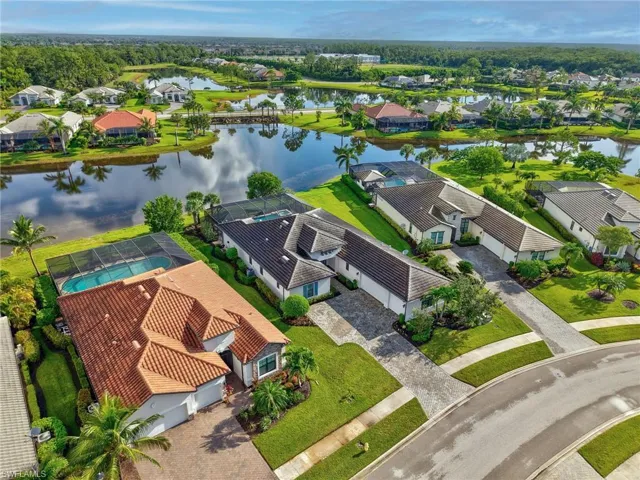 Aerial view of residential area featuring a large body of water