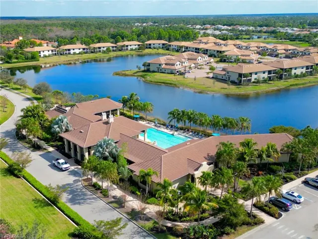 Drone / aerial view of a large body of water and a pool area