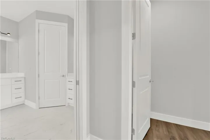 Bathroom with hardwood / wood-style floors and vanity