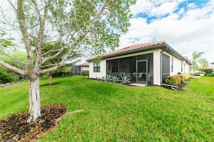 Escape into the privacy of this quiet nature filled backyard.