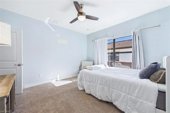 Bedroom featuring carpet and a ceiling fan