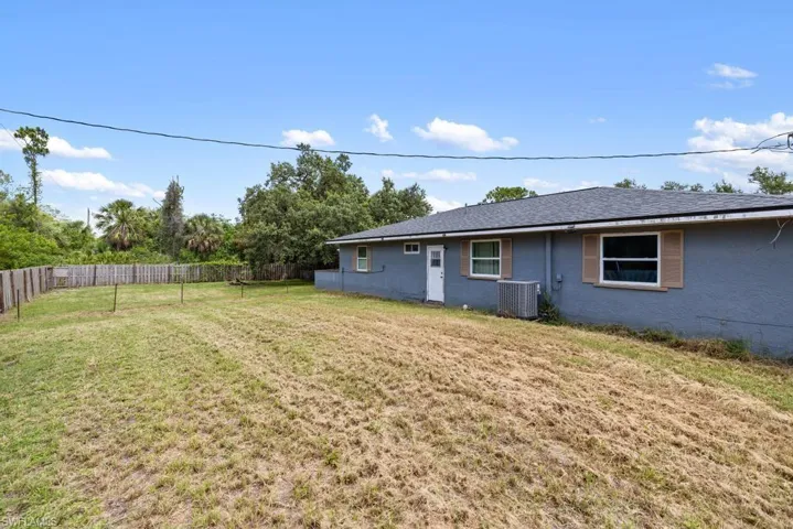 Rear of home - door is to the guest bath.