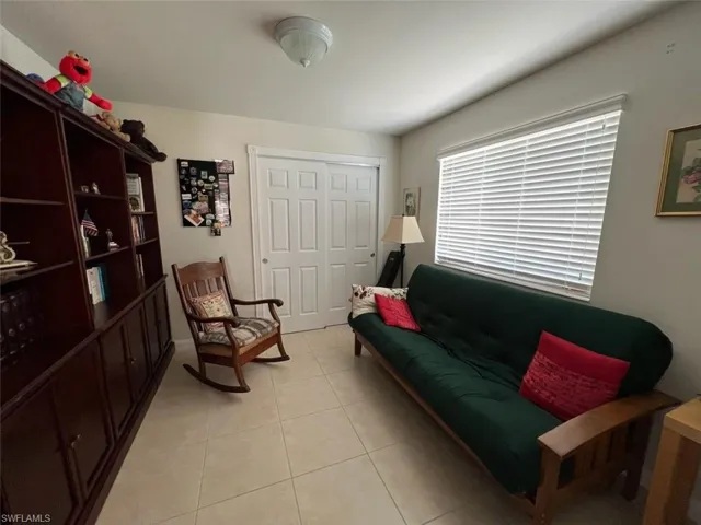 Living area with light tile patterned flooring