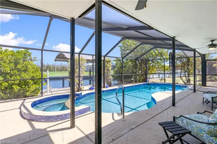 HUGE expansive under shade patio with sparkling pool and spa - a beautiful back yard retreat to enjoy the weather year round!