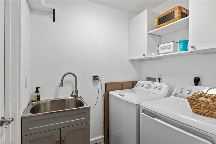 Laundry room with built-in storage, and ample counter space—designed for convenience and efficiency.